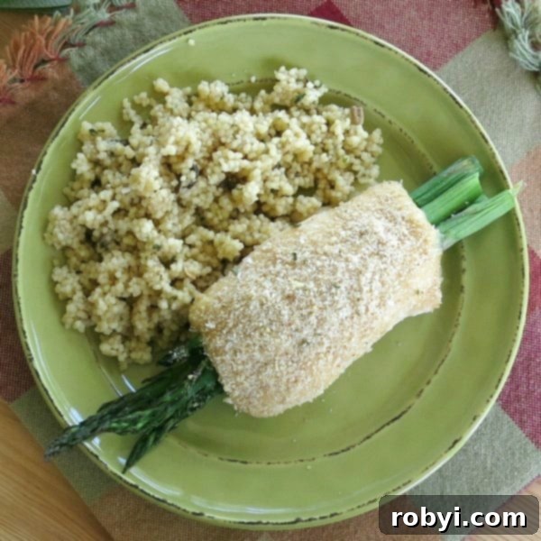 Flavorful Chicken Asparagus Roll-ups on a white plate, garnished and ready to serve