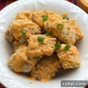 Healthy bang bang chicken that was baked in the oven in a bowl.