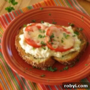 open faced tuna melt on a plate
