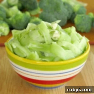Raw Broccoli Stalk Salad in a bowl with feta.