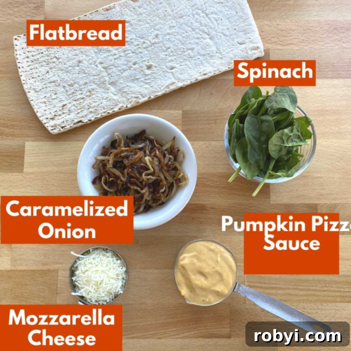 A curated selection of labeled ingredients arranged beautifully, showcasing everything required to make a mouth-watering pumpkin flatbread pizza from scratch.