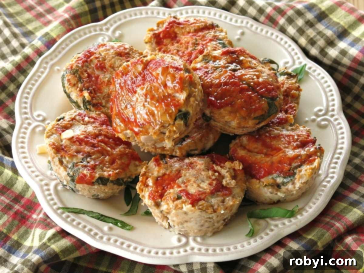 Southwest Turkey Meatloaf Muffins 6 Plate of turkey salsa meatloaf muffins stacked on top of each other, ready to be served.