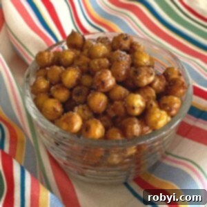 Sweet and spicy roasted chickpeas in a glass bowl.