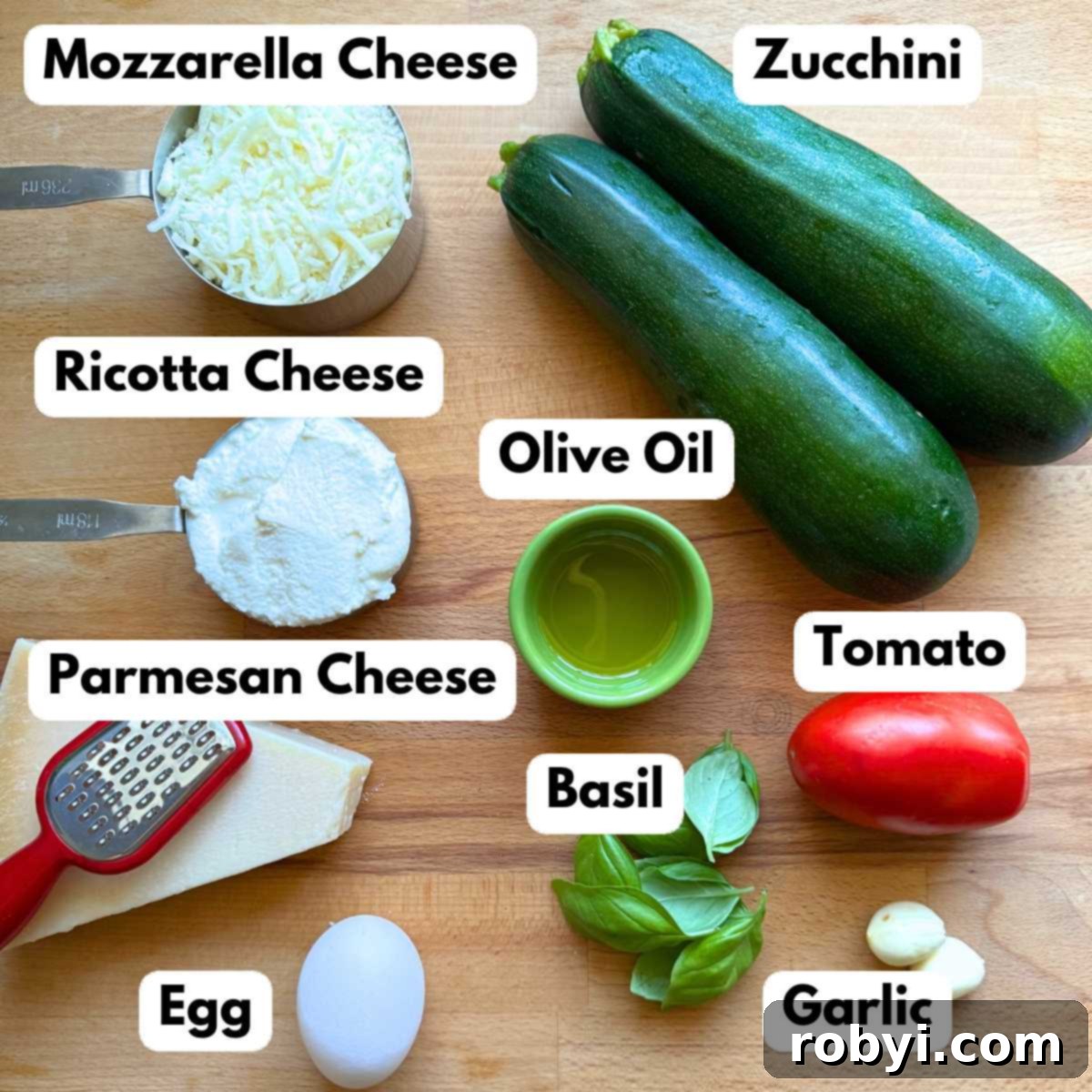 Naked Zucchini Noodle Tart 3 Assortment of fresh ingredients laid out to make the crustless zucchini pie: green zucchini, creamy mozzarella cheese, fresh ricotta cheese, golden olive oil, grated Parmesan cheese, ripe red tomato, vibrant green basil leaves, and two cloves of garlic.